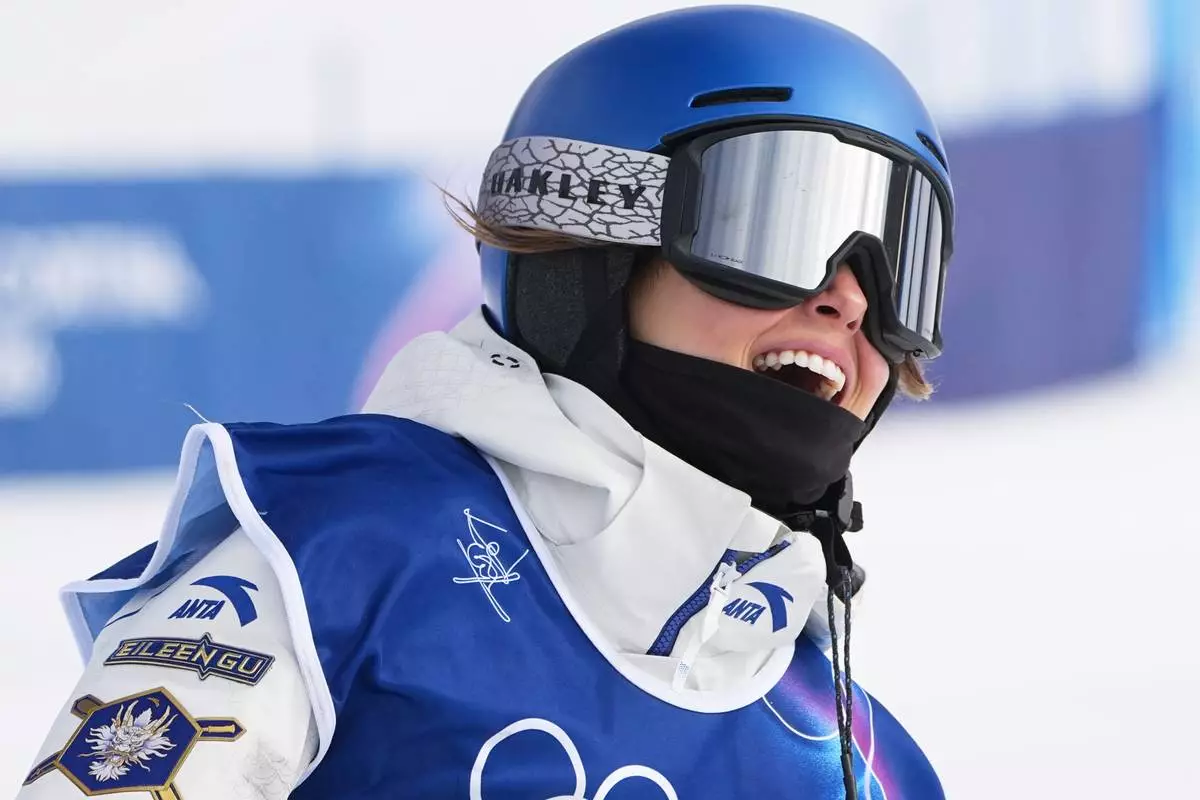 China's Eileen Gu celebrates during the women's freestyle skiing slopestyle finals at the 2026 Winter Olympics, in Livigno, Italy, Monday, Feb. 9, 2026. (AP Photo/Gregory Bull)