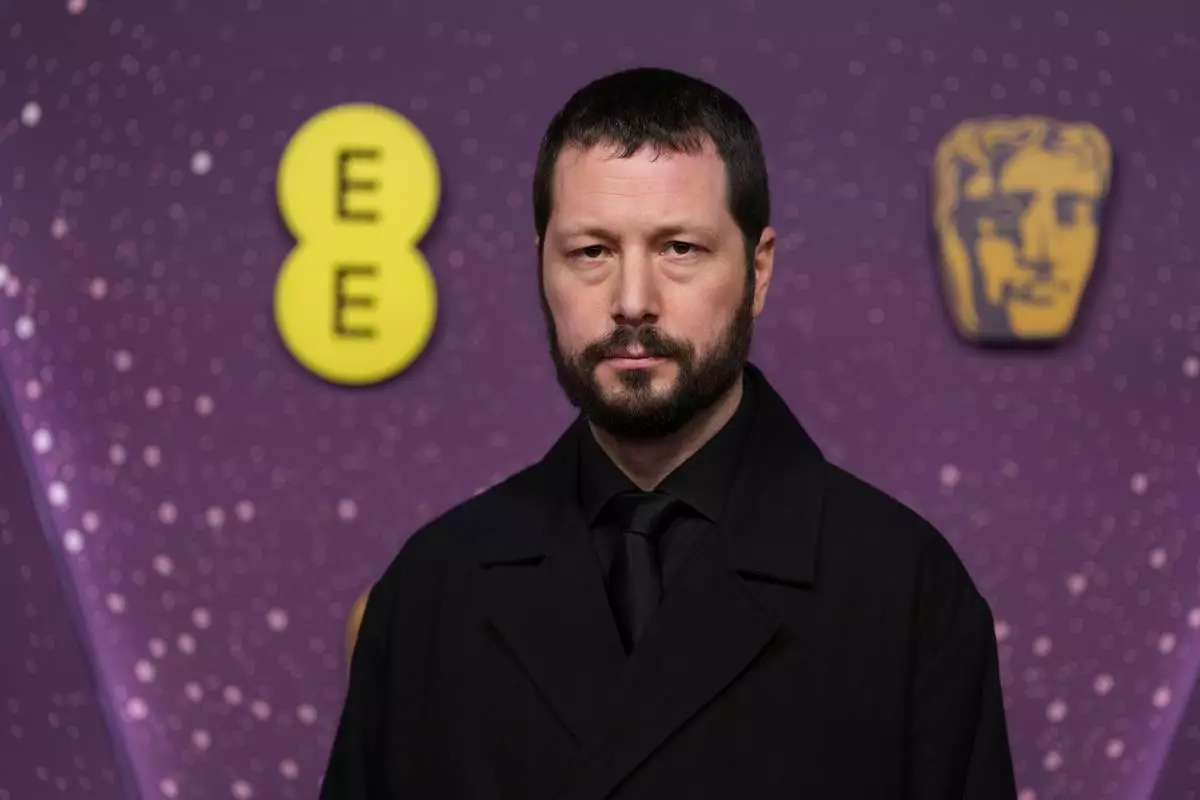 Mstyslav Chernov poses for photographers upon arrival at the 79th British Academy Film Awards, BAFTA's, in London, Sunday, Feb. 22, 2026. (AP Photo/Alastair Grant)