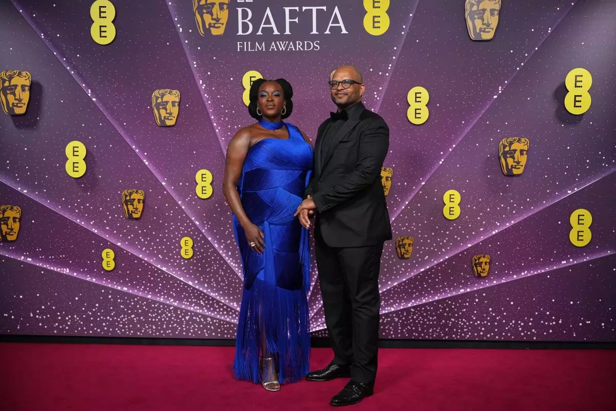 Wunmi Mosaku, left and Tash Moseley pose for photographers upon arrival at the 79th British Academy Film Awards, BAFTA's, in London, Sunday, Feb. 22, 2026. (AP Photo/Alastair Grant)