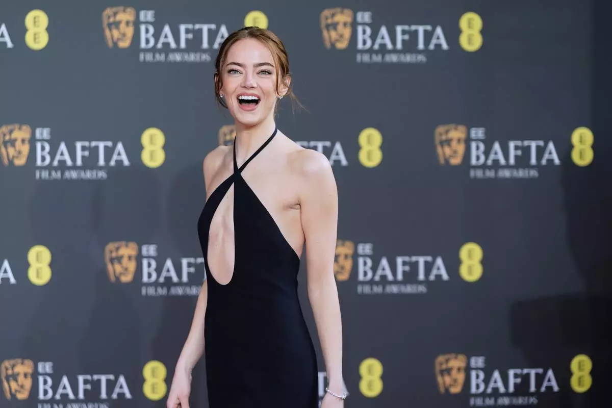 Emma Stone poses for photographers upon arrival at the 79th British Academy Film Awards, BAFTA's, in London, Sunday, Feb. 22, 2026. (AP Photo/Alberto Pezzali)