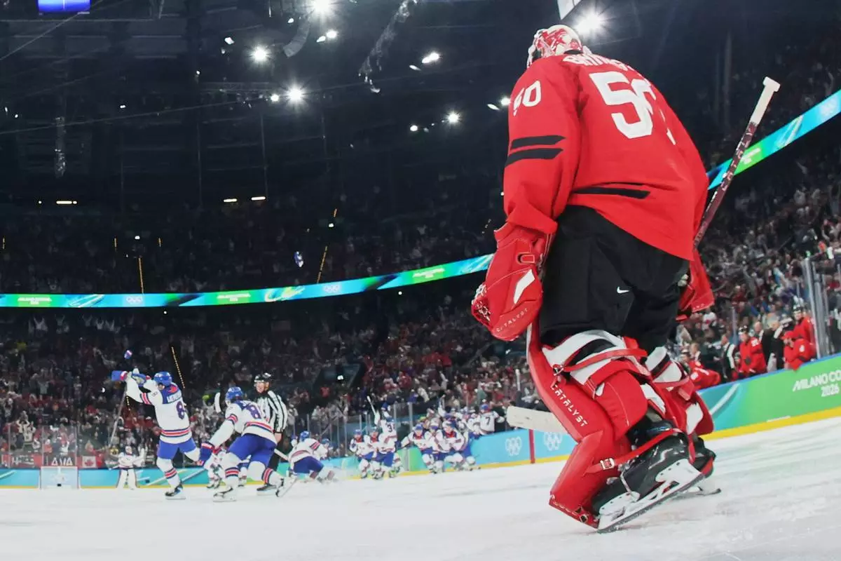 Canada's Jordan Binnington (50) reacts after United States' Jack Hughes, not seen, scored his side's second goal during a men's ice hockey gold medal game between Canada and the United States at the 2026 Winter Olympics, in Milan, Italy, Sunday, Feb. 22, 2026. (Bruce Bennett/Pool Photo via AP)