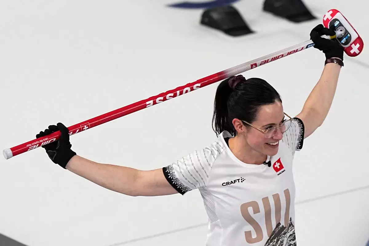 Switzerland's Carole Howald reacts during a women's curling semifinal match against the United States, at the 2026 Winter Olympics, in Cortina d'Ampezzo, Italy, Friday, Feb. 20, 2026. (AP Photo/Fatima Shbair)