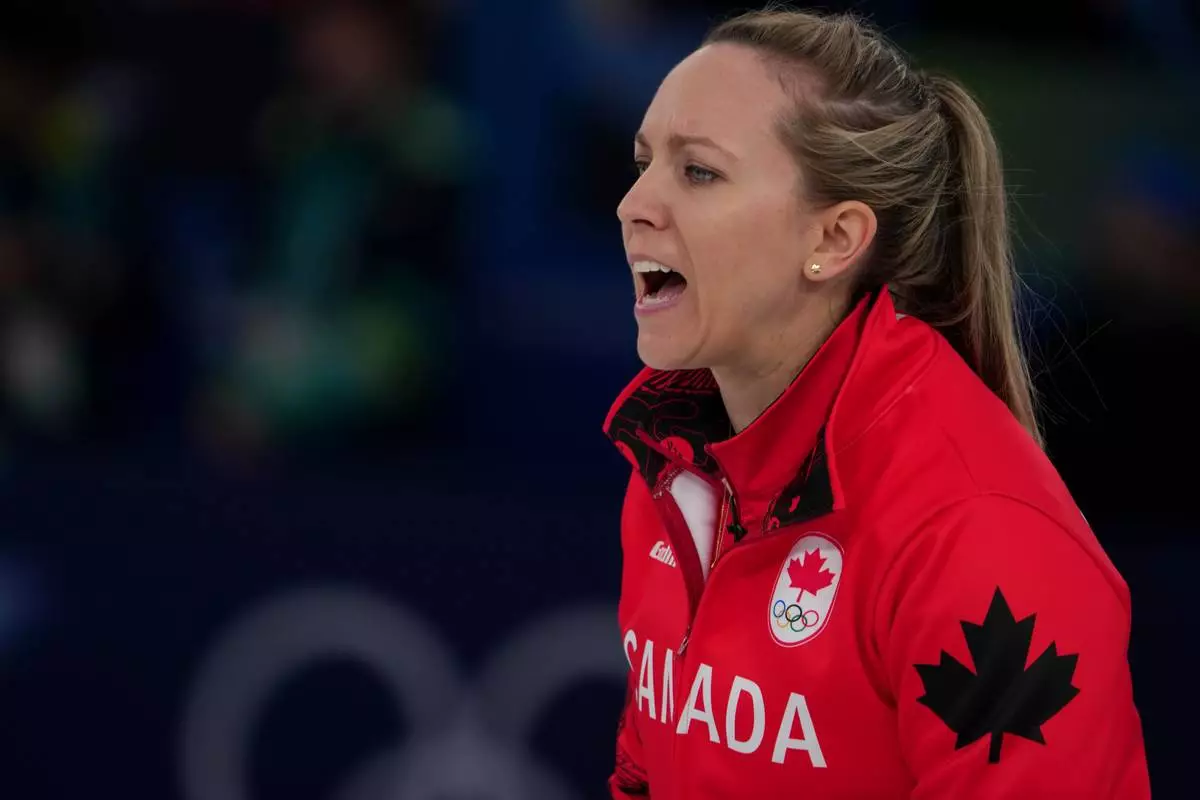Canada's Rachel Homan in action during a women's curling semifinal match against Sweden, at the 2026 Winter Olympics, in Cortina d'Ampezzo, Italy, Friday, Feb. 20, 2026. (AP Photo/Misper Apawu)