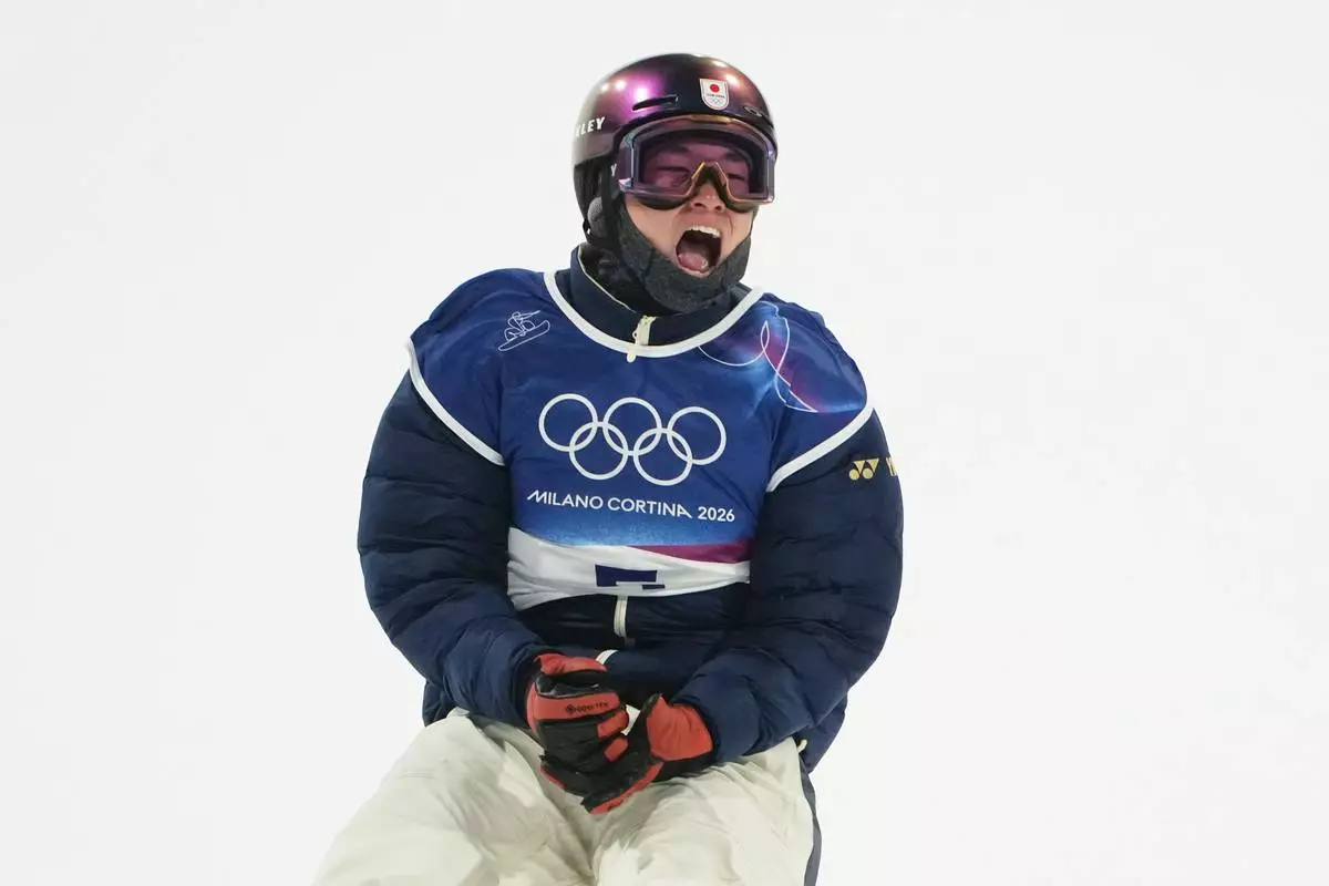 Japan's Kira Kimura reacts during the men's snowboarding big air finals at the 2026 Winter Olympics, in Livigno, Italy, Saturday, Feb. 7, 2026. (AP Photo/Lindsey Wasson)