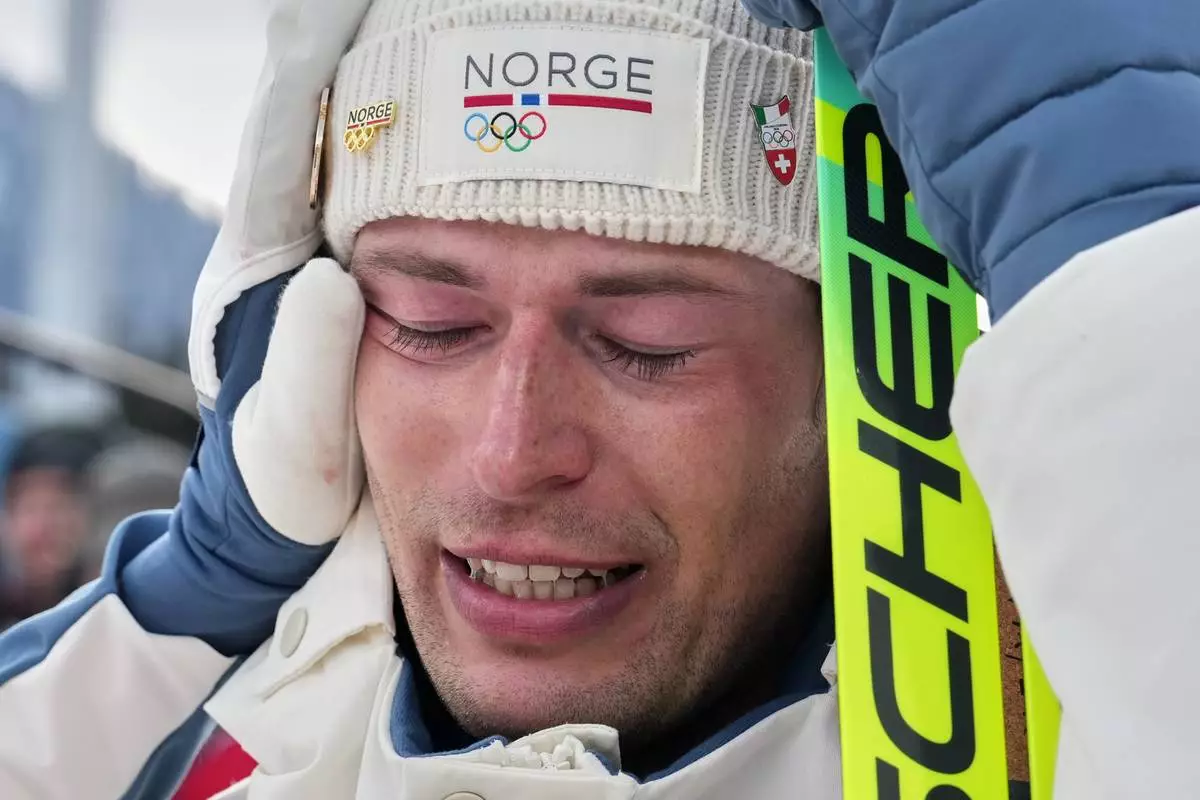 Sturla Holm Laegreid, of Norway, reacts after he won bronze in the men's 20-kilometer individual biathlon race at the 2026 Winter Olympics in Anterselva, Italy, Tuesday, Feb. 10, 2026. (AP Photo/Andrew Medichini)