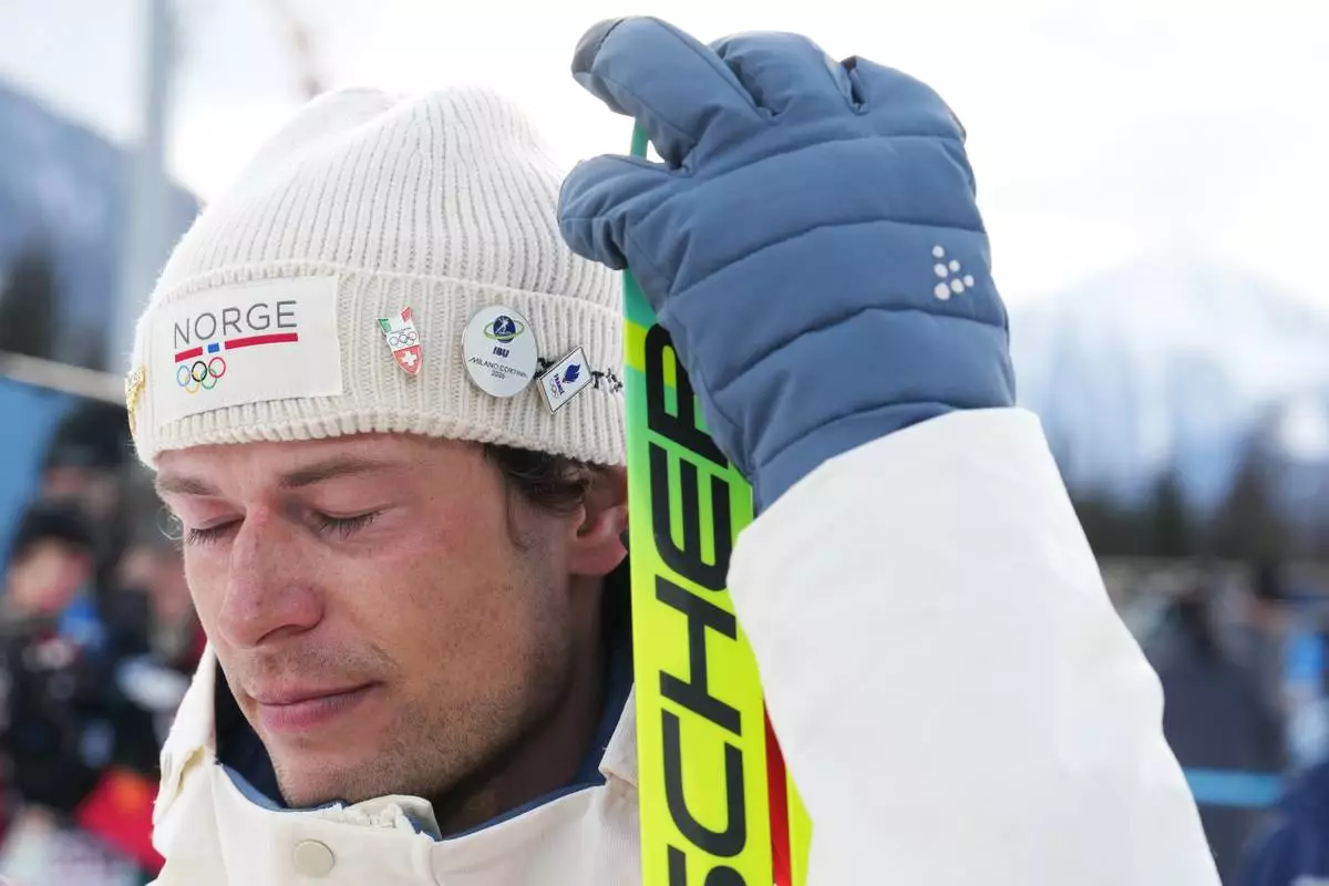 Sturla Holm Laegreid, of Norway, reacts after he won bronze in the men's 20-kilometer individual biathlon race at the 2026 Winter Olympics in Anterselva, Italy, Tuesday, Feb. 10, 2026. (AP Photo/Andrew Medichini)