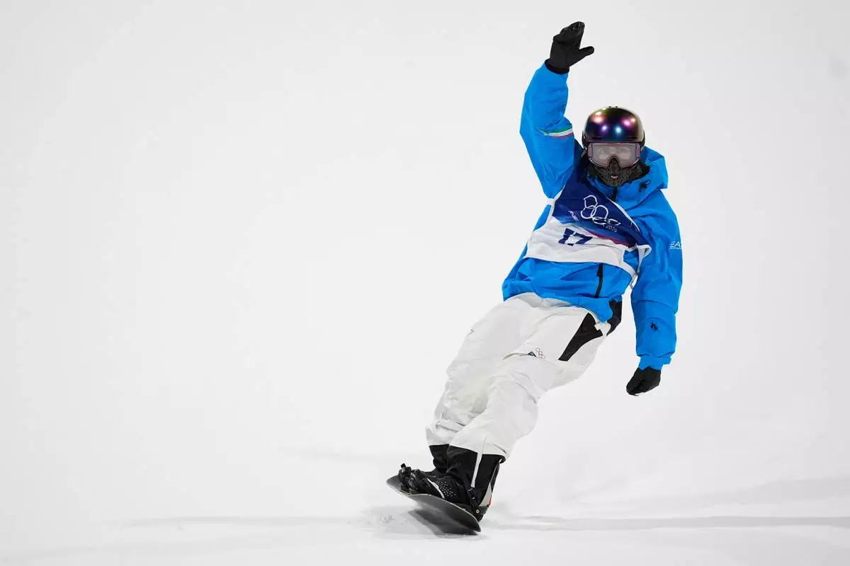 Italy's Ian Matteoli reacts during men's snowboard big air qualifications at the 2026 Winter Olympics, in Livigno, Italy, Thursday, Feb. 5, 2026. (AP Photo/Abbie Parr)