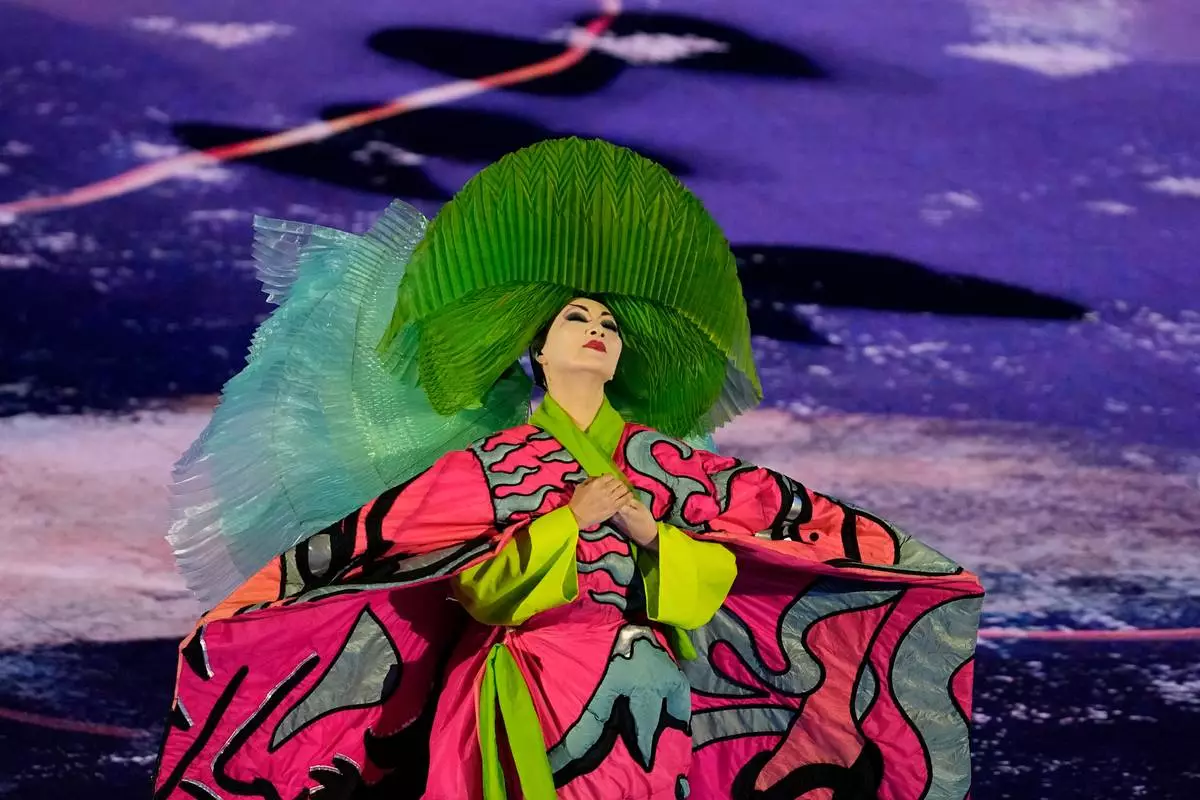 An artist performs during the closing ceremony of the 2026 Winter Olympics, in Verona, Italy, Sunday, Feb. 22, 2026. (AP Photo/Ashley Landis)