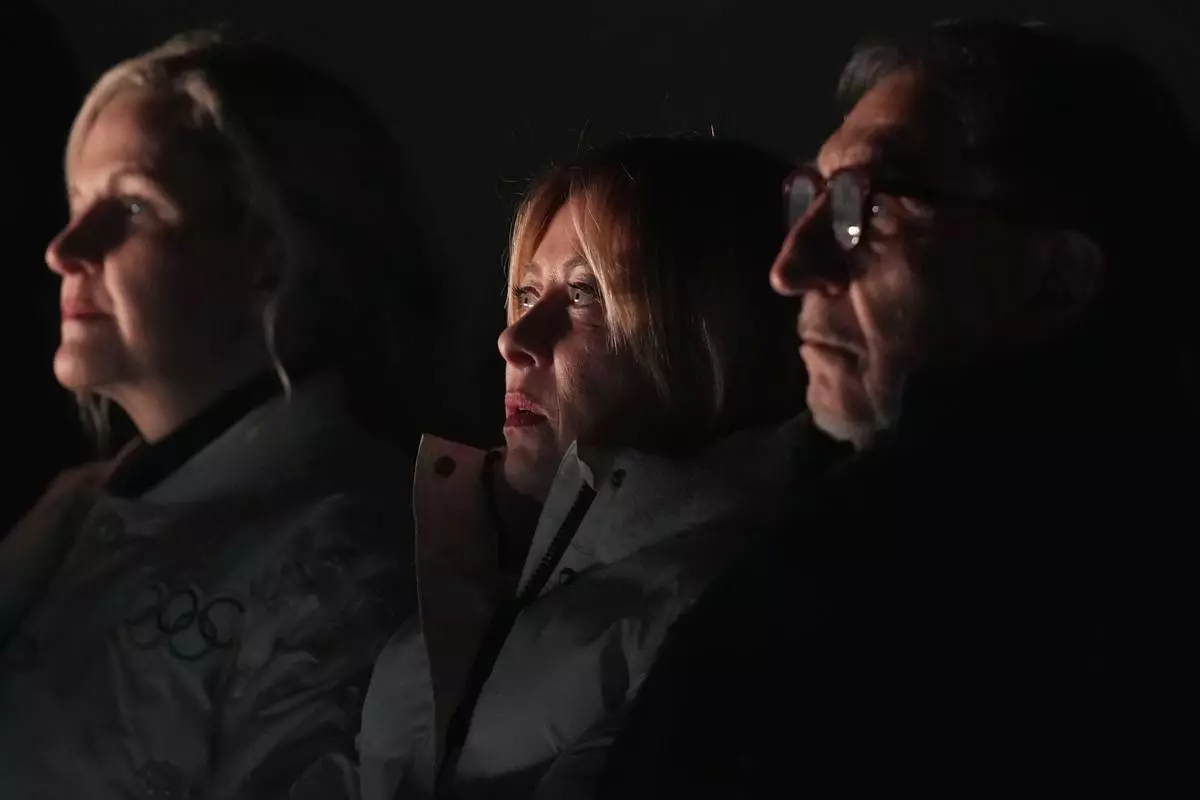 Italy's Prime Minister Giorgia Meloni, center, attends the closing ceremony of the 2026 Winter Olympics, in Verona, Italy, Sunday, Feb. 22, 2026. (AP Photo/Natacha Pisarenko)