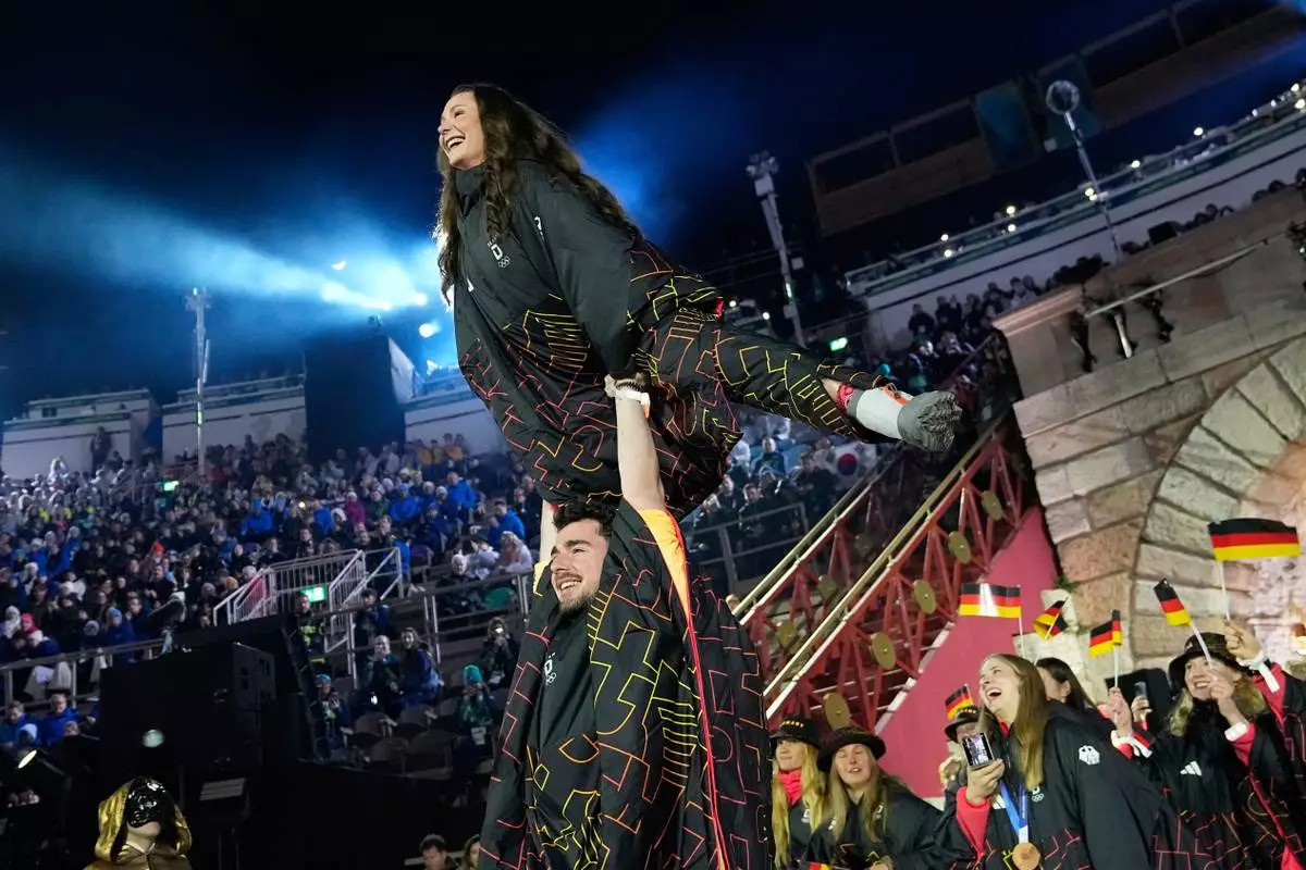 Athletes from Germany attend the closing ceremony of the 2026 Winter Olympics, in Verona, Italy, Sunday, Feb. 22, 2026. (AP Photo/Natacha Pisarenko)