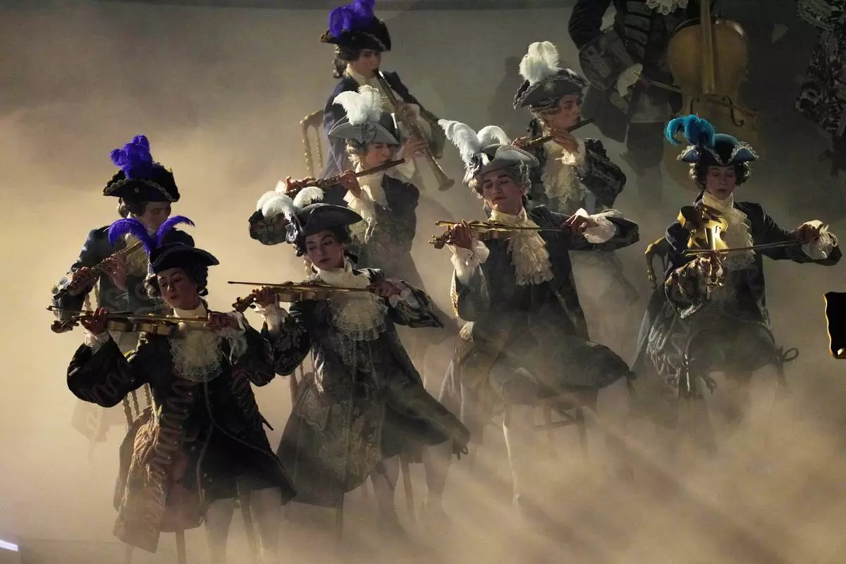 Artists perform during the closing ceremony of the 2026 Winter Olympics, in Verona, Italy, Sunday, Feb. 22, 2026. (AP Photo/Bernat Armangue)