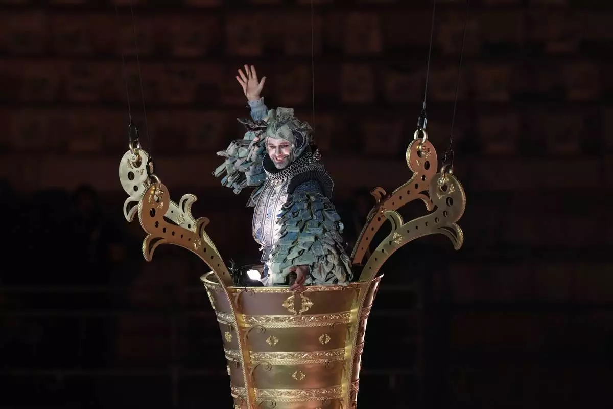 An artist performs during the closing ceremony of the 2026 Winter Olympics, in Verona, Italy, Sunday, Feb. 22, 2026. (AP Photo/Antonio Calanni)