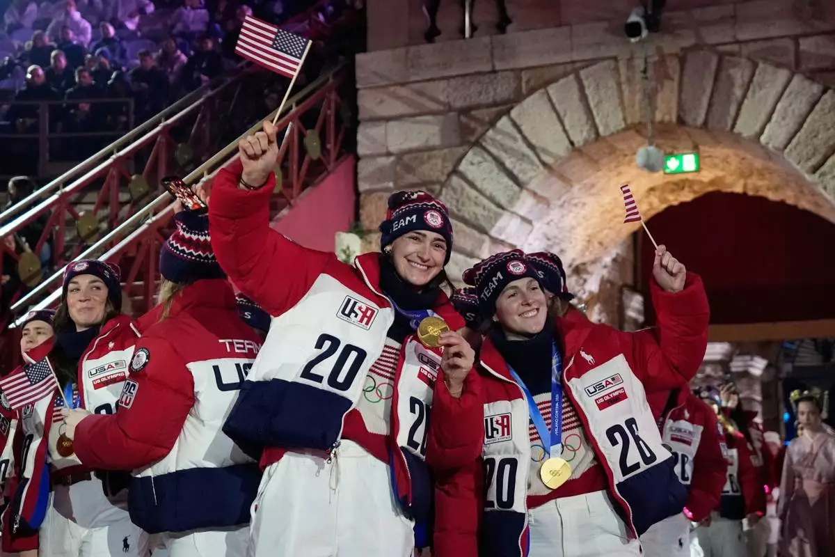 Athletes from the United States attend the closing ceremony of the 2026 Winter Olympics, in Verona, Italy, Sunday, Feb. 22, 2026. (AP Photo/Natacha Pisarenko)