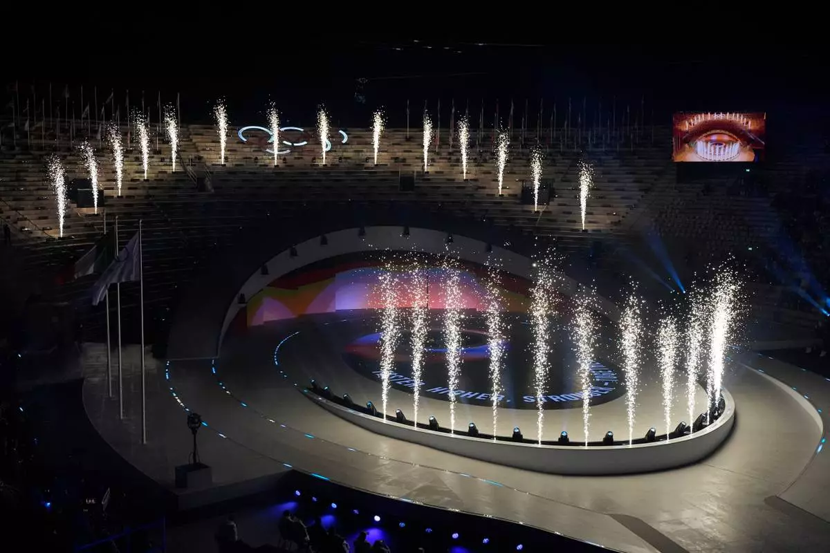 Fireworks light up during the closing ceremony of the 2026 Winter Olympics, in Verona, Italy, Sunday, Feb. 22, 2026. (AP Photo/Ashley Landis)