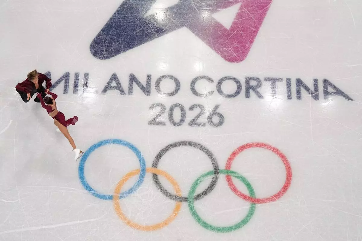 Georgia's Diana Davis and Gleb Smolkin during a figure skating training session at the 2026 Winter Olympics, in Milan, Italy, Thursday, Feb. 5, 2026. (AP Photo/Bernat Armangue)