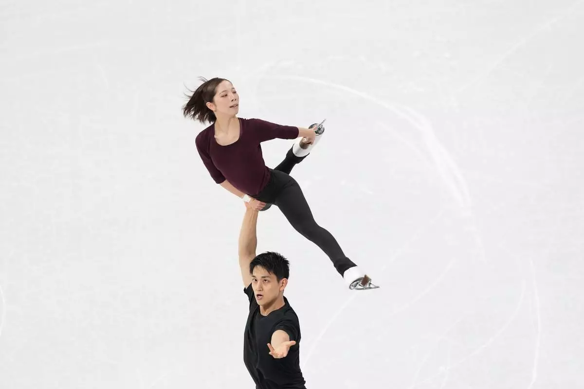 Riku Miura and Ryuichi Kihara, of Japan, perform during a figure skating training session at the 2026 Winter Olympics, in Milan, Italy, Wednesday, Feb. 4, 2026. (AP Photo/Francisco Seco)