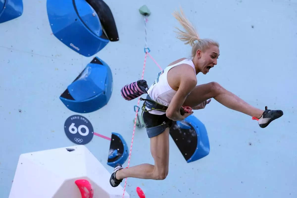 FILE - Janja Garnbret of Slovenia competes in the women's boulder and lead, lead final, during the sport climbing competition at the 2024 Summer Olympics, Aug. 10, 2024, in Le Bourget, France. (AP Photo/Tsvangirayi Mukwazhi, File)