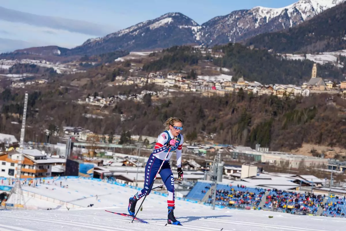 Jessie Diggins, of the United States, competes in the cross country skiing women's 50km mass start classic at the 2026 Winter Olympics, in Tesero, Italy, Sunday, Feb. 22, 2026. (AP Photo/Kirsty Wigglesworth)