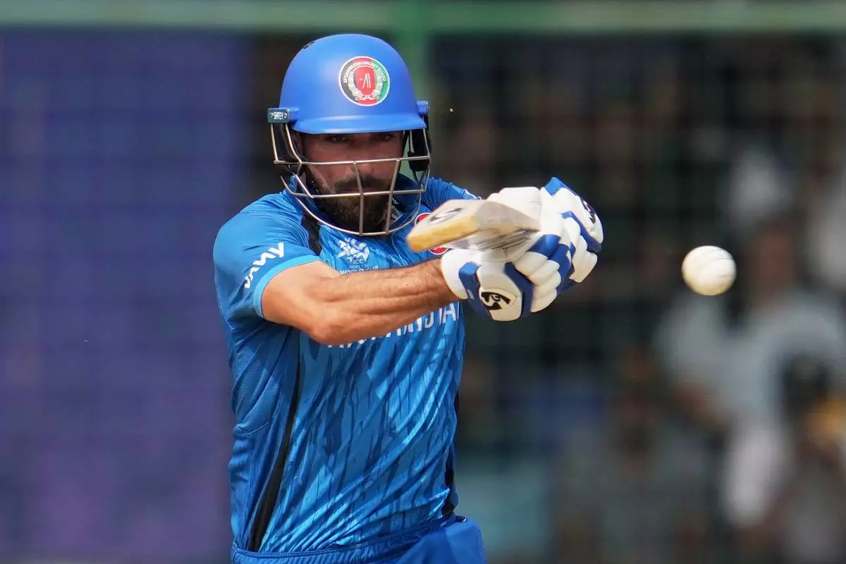 Afghanistan's Ibrahim Zardan plays a shot during the T20 World Cup cricket match between Afghanistan and United Arab Emirates in New Delhi, India, Monday, Feb. 16, 2026. (AP Photo/Manish Swarup)