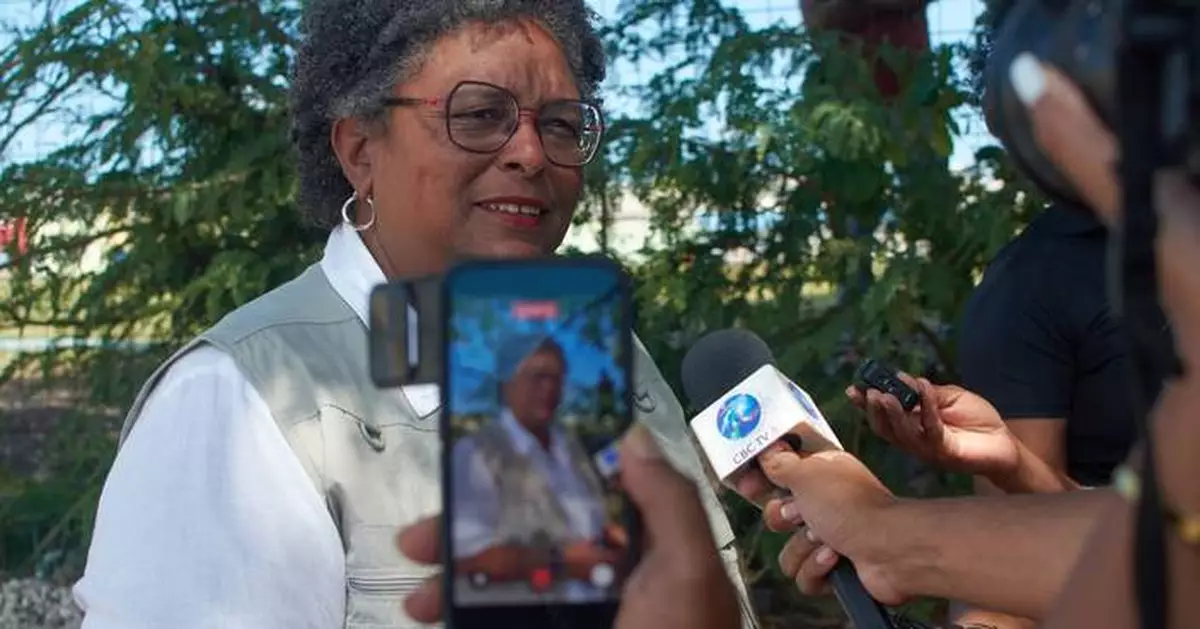 Barbados' prime minister clinches a third term in office after a clean sweep at the polls