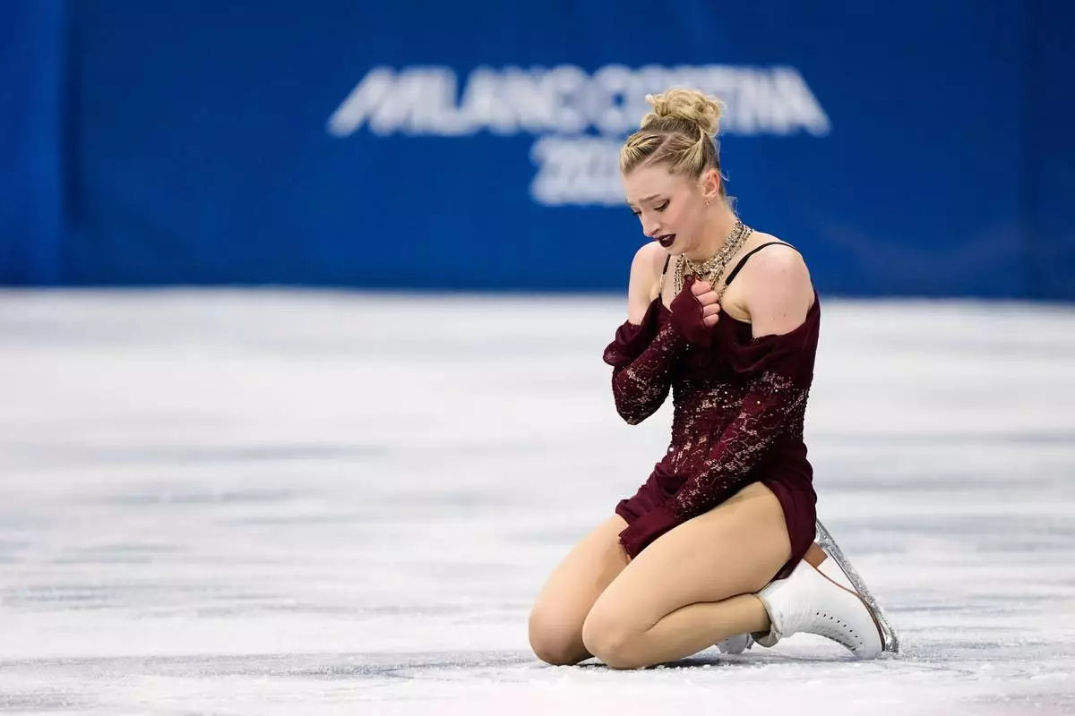 Amber Glenn of the United States competes during the women's short program figure skating at the 2026 Winter Olympics, in Milan, Italy, Tuesday, Feb. 17, 2026. (AP Photo/Natacha Pisarenko)