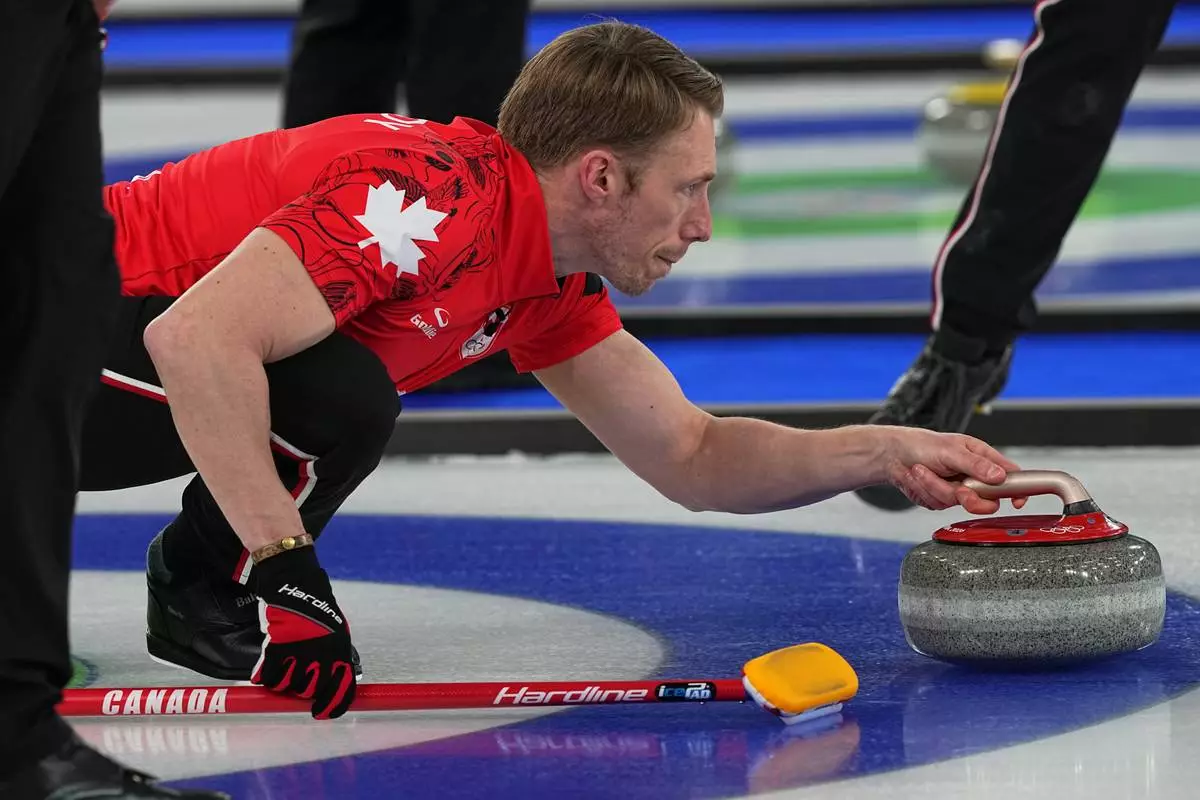 Canada's Marc Kennedy in action during the men's curling round robin session against Britain at the 2026 Winter Olympics, in Cortina d'Ampezzo, Italy, Tuesday, Feb. 17, 2026. (AP Photo/Fatima Shbair)