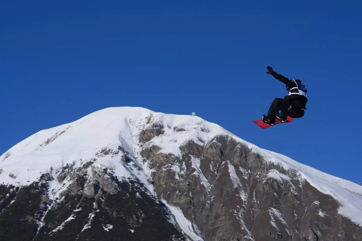 New Zealand's Zoi Sadowski-Synnott during the women's snowboarding slopestyle qualifications at the 2026 Winter Olympics, in Livigno, Italy, Sunday, Feb. 15, 2026. (AP Photo/Julia Demaree Nikhinson)