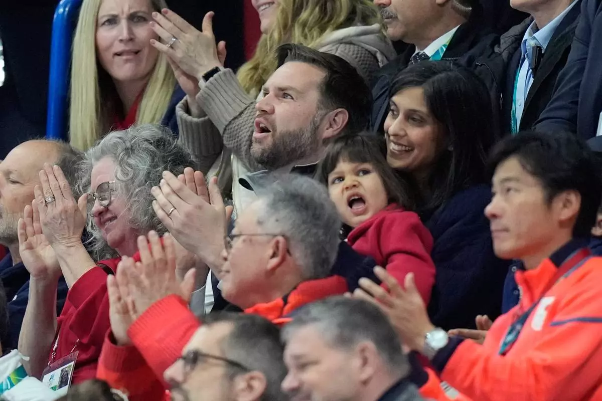 Vice President JD Vance, center, and his wife Usha Vance applaud while Madison Chock and Evan Bates of the United States compete during the figure skating ice dance team event at the 2026 Winter Olympics, in Milan, Italy, Friday, Feb. 6, 2026. (AP Photo/Francisco Seco)