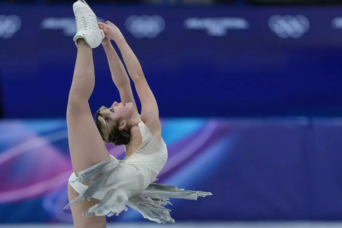 Alysa Lui of the United States competes during the figure skating women's team event at the 2026 Winter Olympics, in Milan, Italy, Friday, Feb. 6, 2026. (AP Photo/Stephanie Scarbrough)