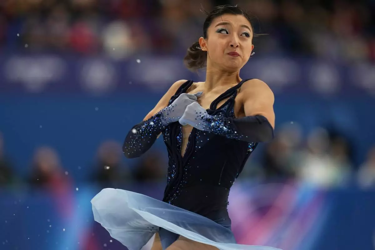 Kaori Sakamoto of Japan competes during the figure skating women's team event at the 2026 Winter Olympics, in Milan, Italy, Friday, Feb. 6, 2026. (AP Photo/Francisco Seco)