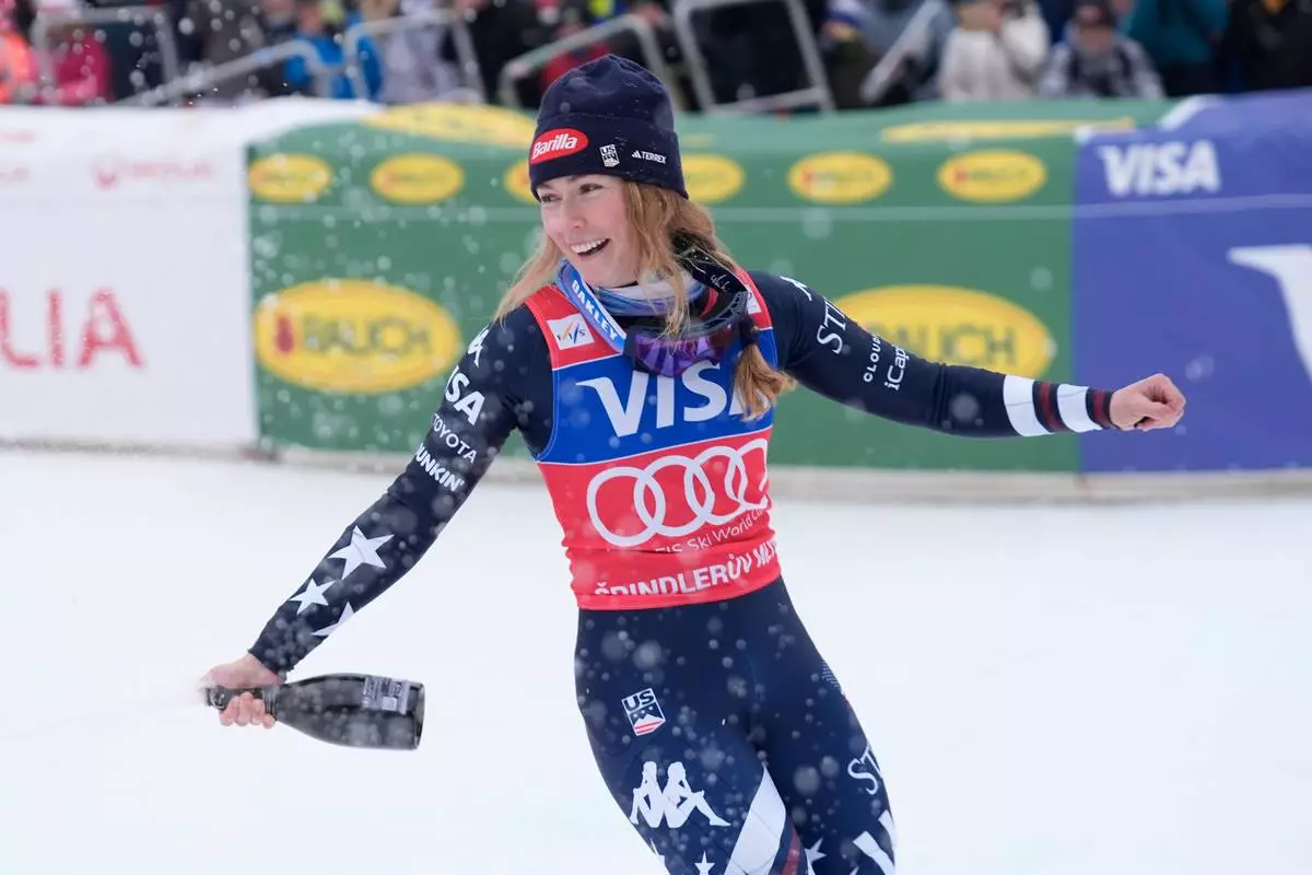 United States' Mikaela Shiffrin celebrates winning an alpine ski, women's World Cup slalom, in Spindleruv Mlyn, Czech Republic, Sunday, Jan. 25, 2026. (AP Photo/Giovanni Auletta)