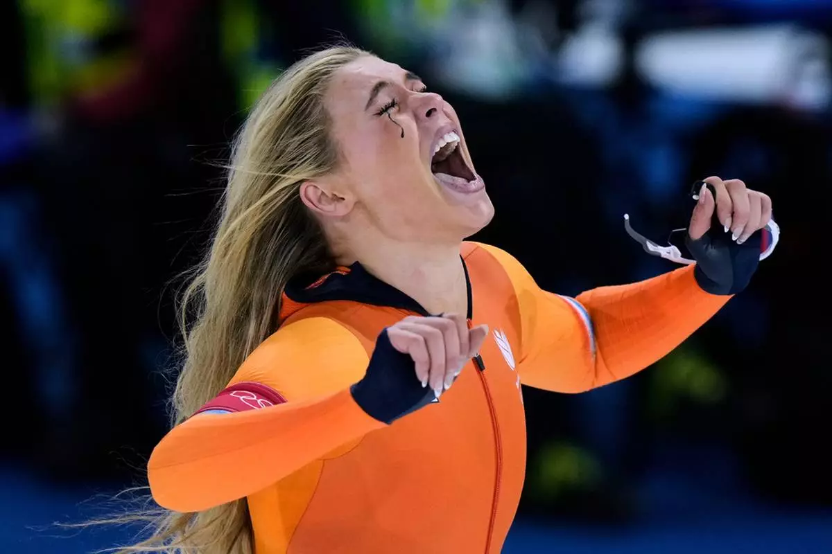 Jutta Leerdam of the Netherlands celebrates winning the gold medal in the women's 1,000 meters speedskating race at the 2026 Winter Olympics, in Milan, Italy, Feb. 9, 2026. (AP Photo/Luca Bruno, File)