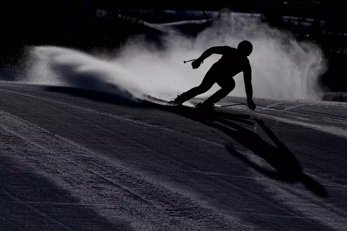 Austria's Daniel Hemetsberger comes into the finish area of an alpine ski men's downhill portion of a team combined race, at the 2026 Winter Olympics, in Bormio, Italy, Feb. 9, 2026. (AP Photo/Rebecca Blackwell, File)