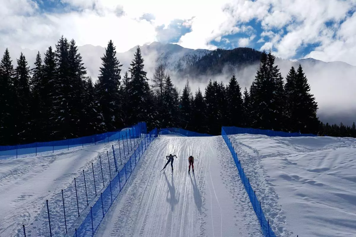 Athletes participate in a biathlon training session at the 2026 Winter Olympics in Anterselva, Italy, Feb. 6, 2026. (AP Photo/Mosa'ab Elshamy, File)