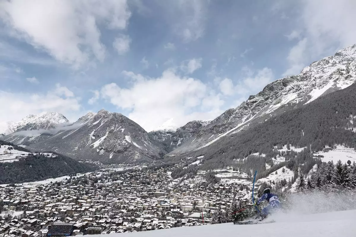 Chile's Tomas Holscher speeds down the course during an alpine ski, men's slalom race, at the 2026 Winter Olympics, in Bormio, Italy, Feb. 16, 2026. (AP Photo/Gabriele Facciotti, File)