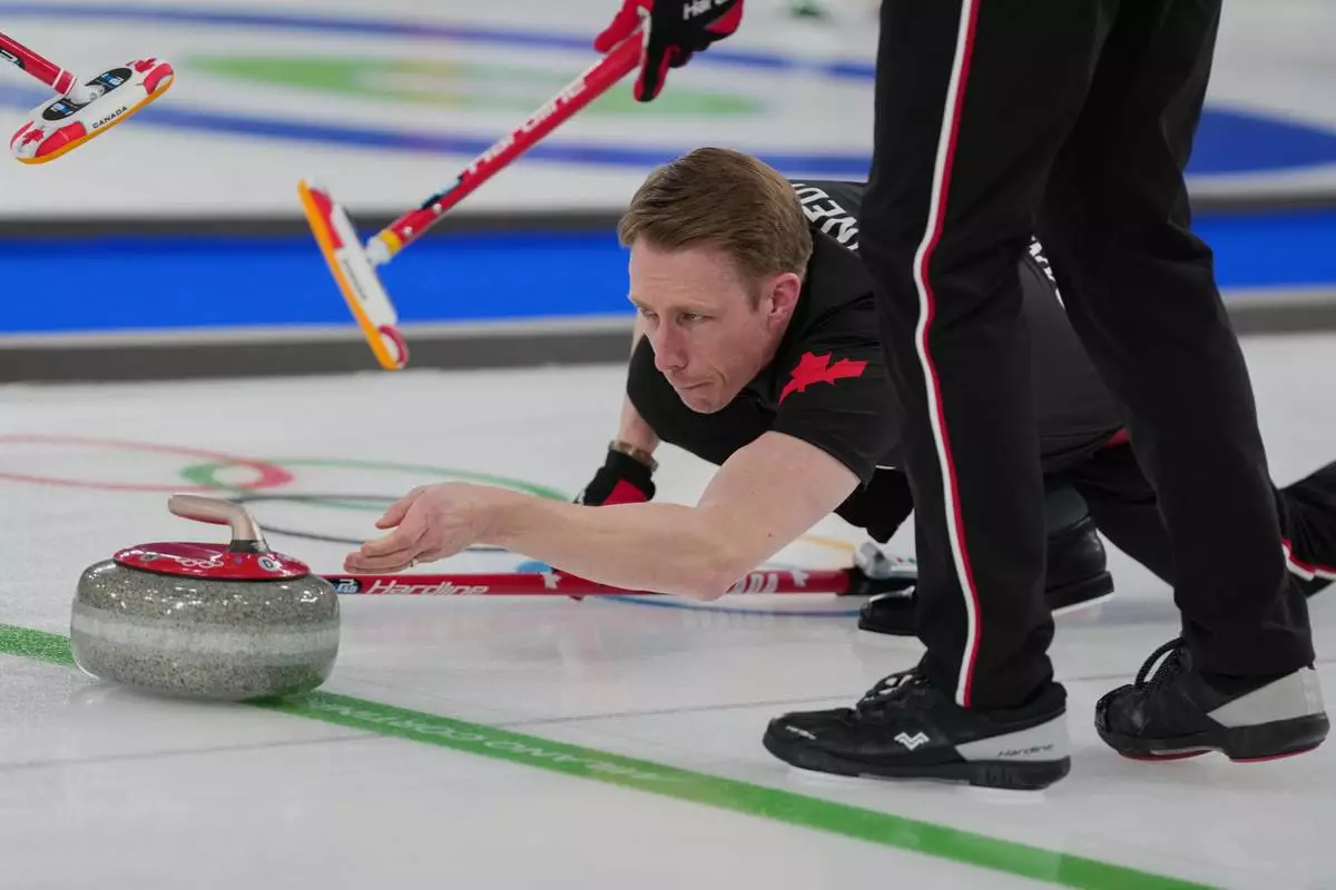 Canada's Marc Kennedy in action during the men's curling round robin session against Sweden, at the 2026 Winter Olympics, in Cortina d'Ampezzo, Italy, Feb. 13, 2026. (AP Photo/Misper Apawu, File)