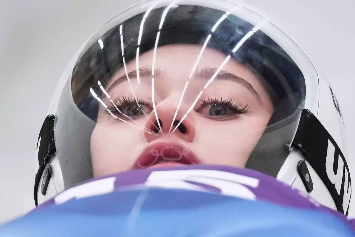 Individual Neutral Athlete Daria Olesik starts for a women's Luge training session at the 2026 Winter Olympics, in Cortina d'Ampezzo, Italy, Feb. 5, 2026. (AP Photo/Alessandra Tarantino, File)