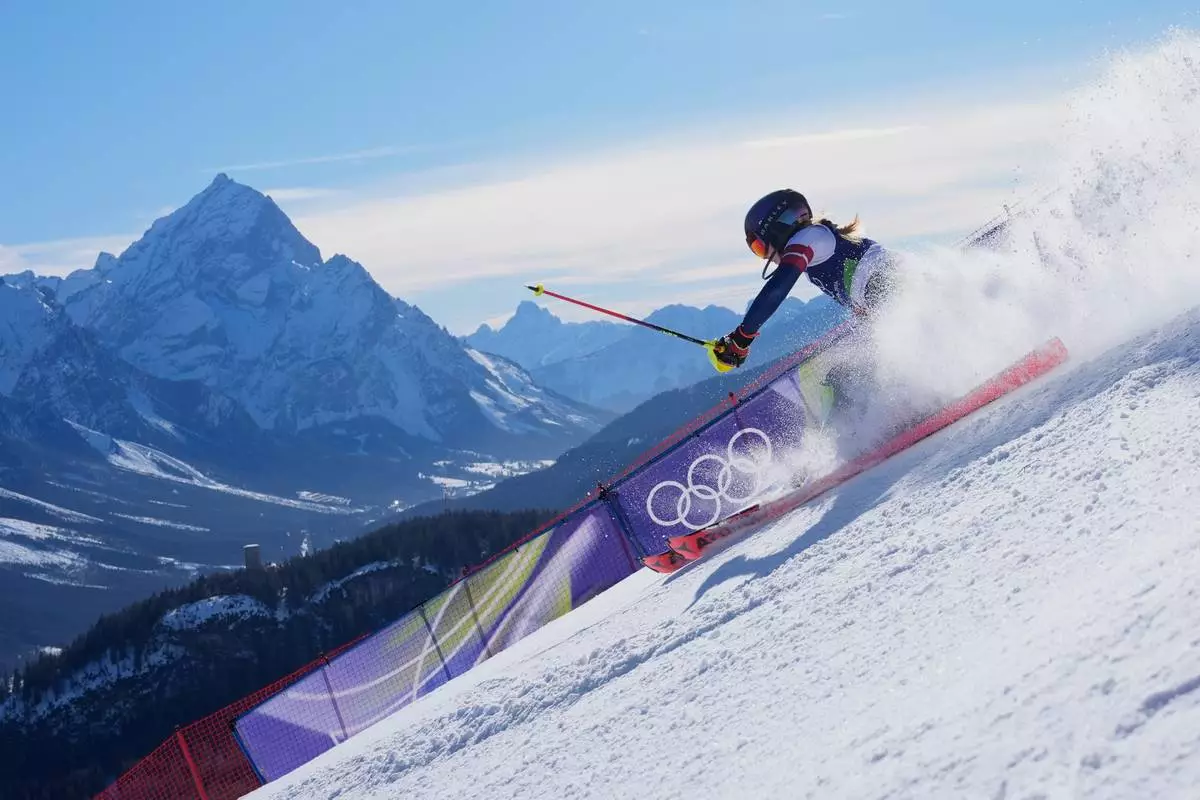 Mikaela Shiffrin competes in the women's slalom race at the 2026 Winter Olympics, in Cortina d'Ampezzo, Italy, Feb. 18, 2026. (AP Photo/Robert F. Bukaty, File)
