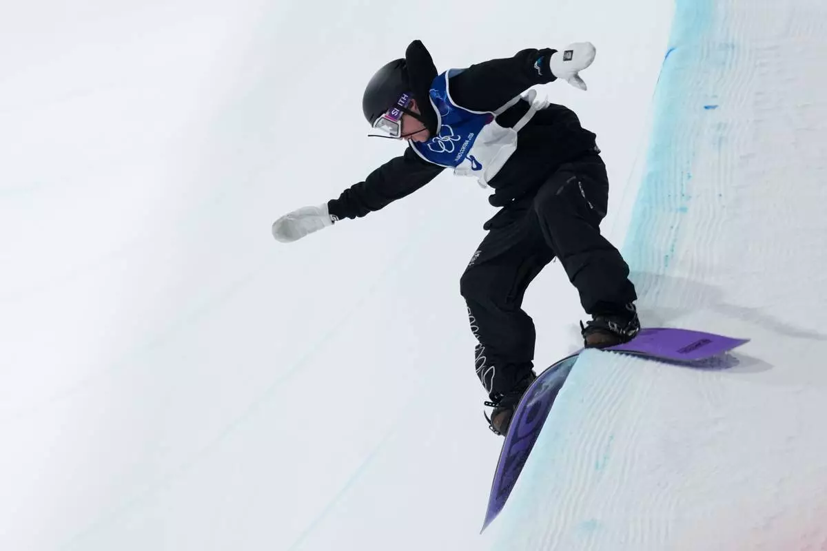 New Zealand's Campbell Melville Ives lands during the men's snowboarding halfpipe finals at the 2026 Winter Olympics, in Livigno, Italy, Feb. 13, 2026. (AP Photo/Abbie Parr, File)