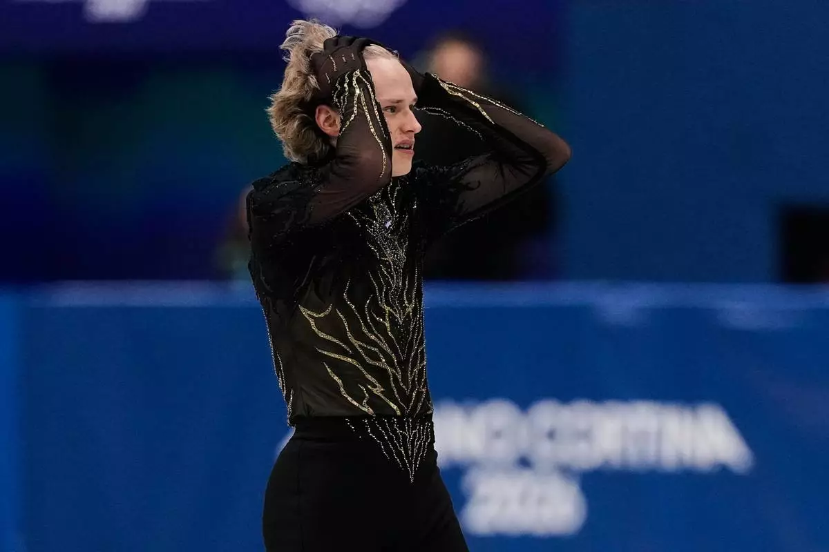 Ilia Malinin of the United States competes during the men's free skate program in figure skating at the 2026 Winter Olympics, in Milan, Italy, Friday, Feb. 13, 2026. (AP Photo/Ashley Landis)