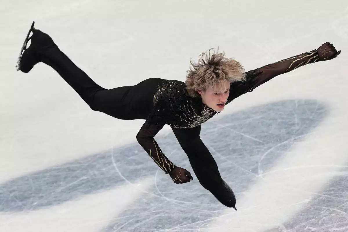 Ilia Malinin of the United States competes during the men's free skate program in figure skating at the 2026 Winter Olympics, in Milan, Italy, Friday, Feb. 13, 2026. (AP Photo/Francisco Seco)