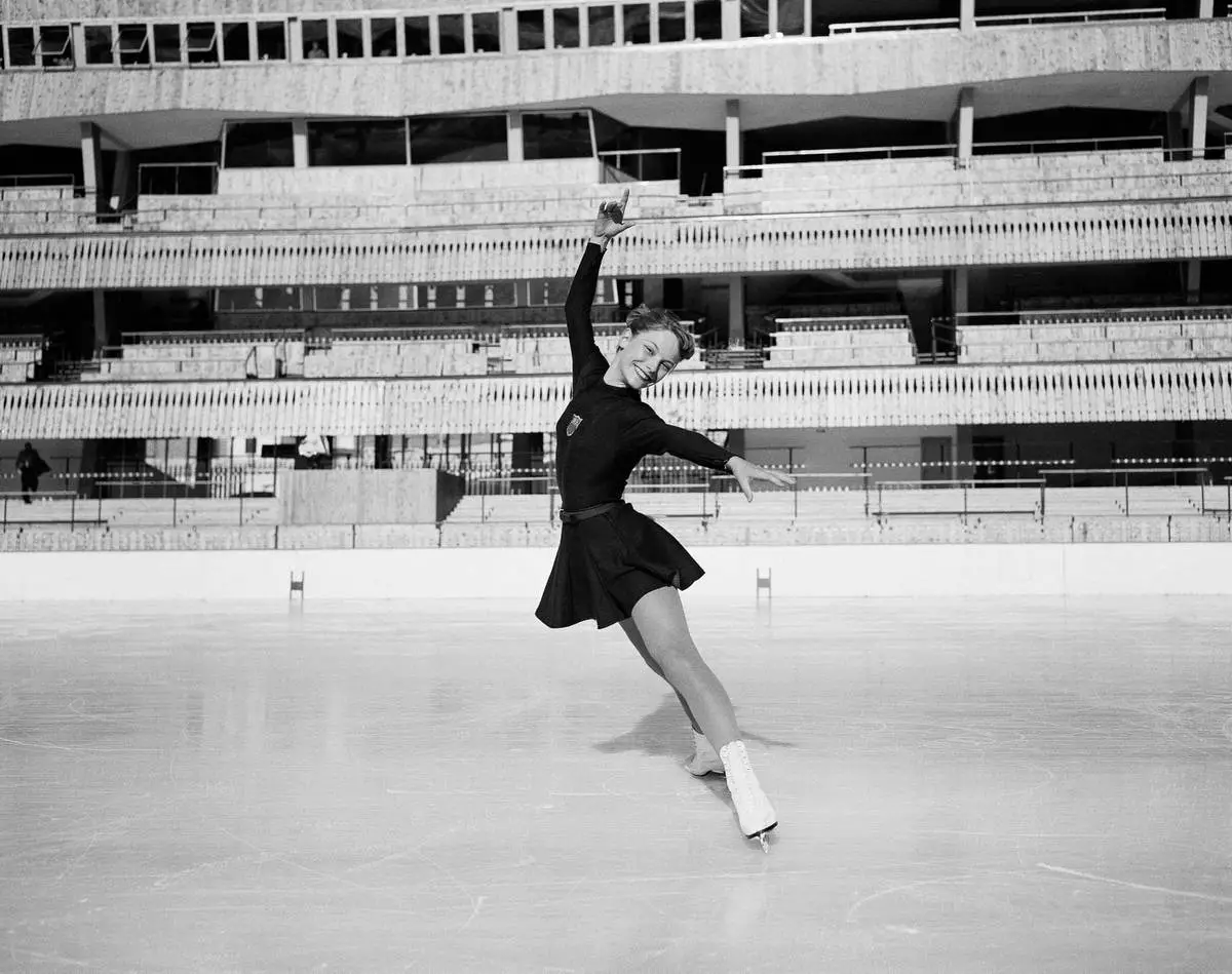 FILE - Carol Heiss warms up at the Ice Stadium, in Cortina d'Ampezzo, Italy, Jan. 21, 1956. (AP Photo/Raoul Fornezza, File)