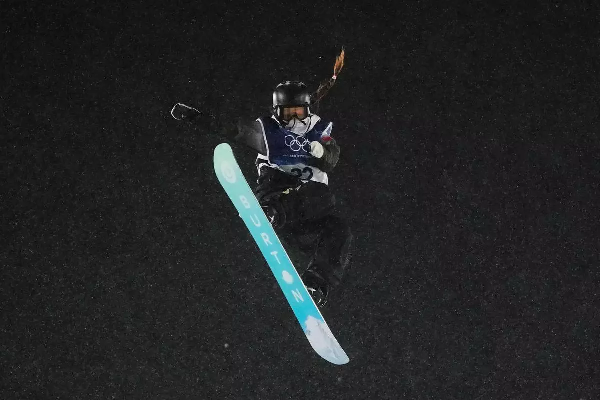 China's Zhang Xiaonan practices during a snowboard big air training session at the 2026 Winter Olympics, in Livigno, Italy, Wednesday, Feb. 4, 2026. (AP Photo/Lindsey Wasson)