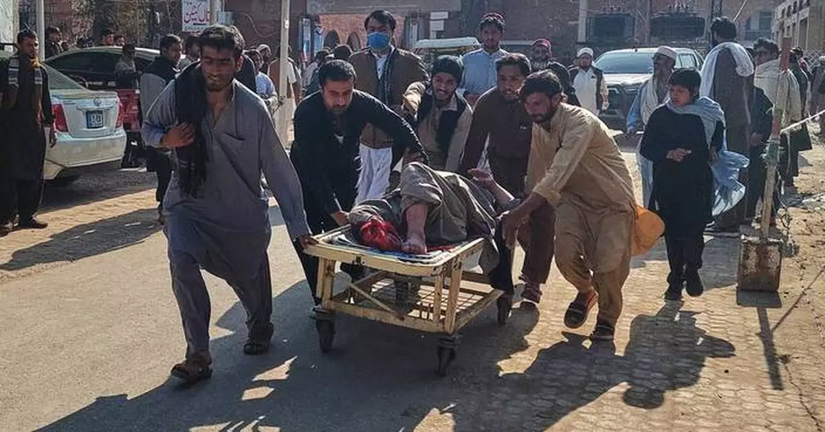 Motorcycle bomb at police station kills at least 2 and wounds several in northwestern Pakistan
