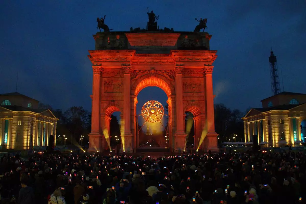 A view of the Olympic cauldron at the Arco della Pace, during the evening light show, at the 2026 Winter Olympics, in Milan, Italy, Monday, Feb. 9, 2026. (AP Photo/Annie Risemberg)