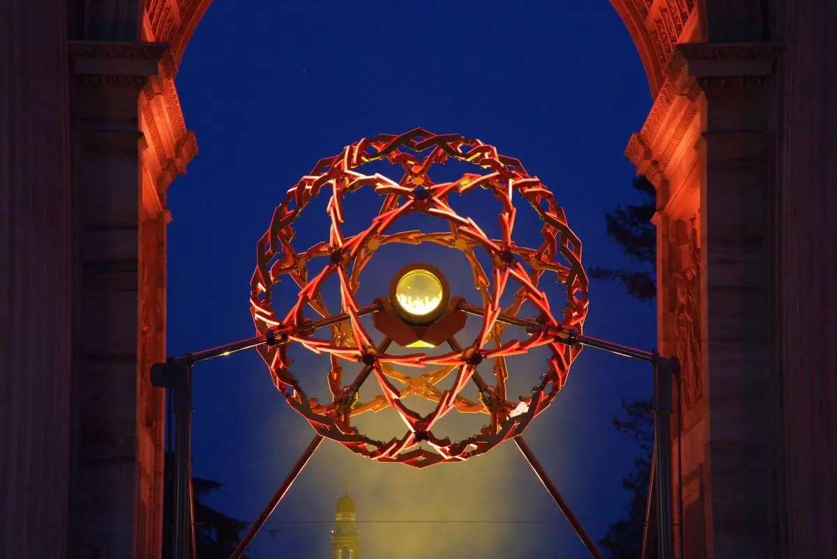 A view of the Olympic cauldron during the evening light show, at the 2026 Winter Olympics, in Milan, Italy, Monday, Feb. 9, 2026. (AP Photo/Annie Risemberg)