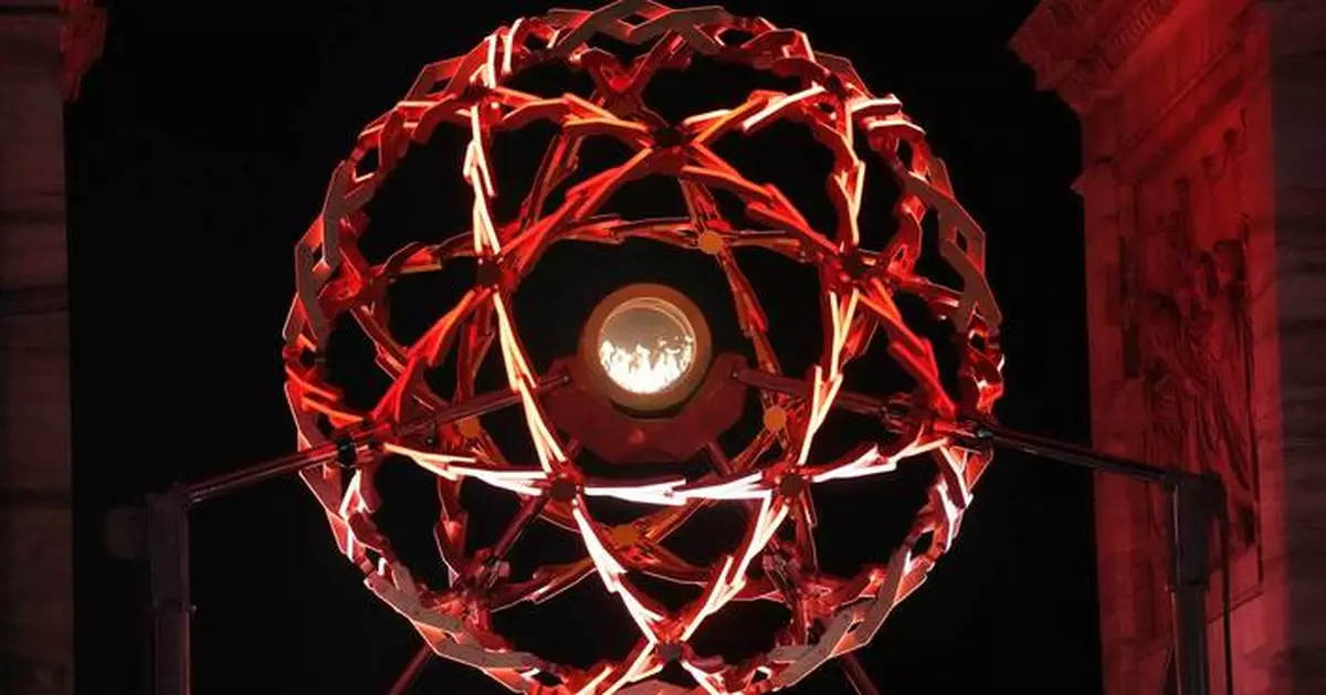 Milan's nightly Olympic cauldron light show draws thousands to Arch of Peace