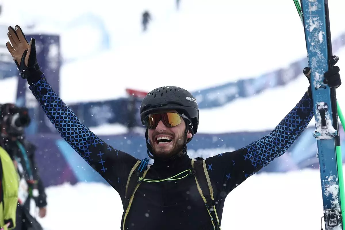 Individual Neutral Athlete Nikita Filippov celebrates winning the silver medal in a ski mountaineering men's final at the 2026 Winter Olympics, in Bormio, Italy, Thursday, Feb. 19, 2026. (AP Photo/Gabriele Facciotti)