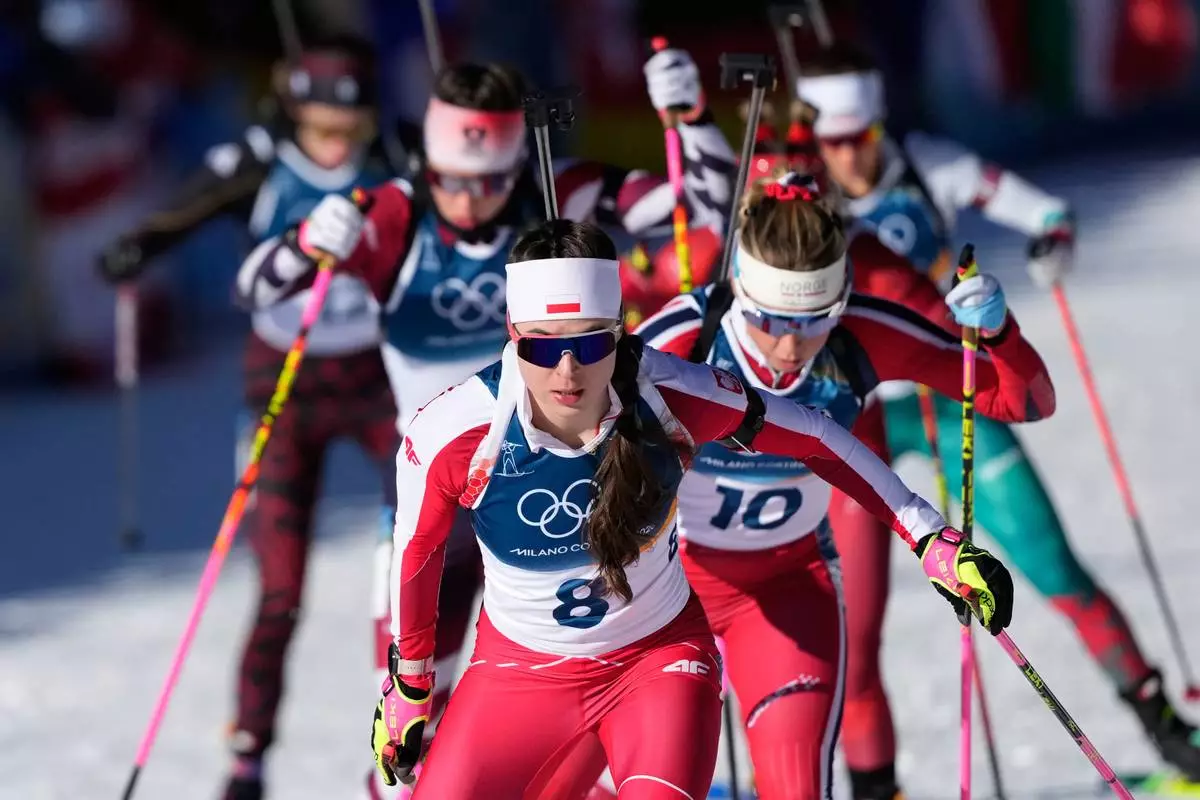 Kamila Zuk, of Poland, leads a group during the women's 10-kilometer pursuit biathlon race at the 2026 Winter Olympics in Anterselva, Italy, Sunday, Feb. 15, 2026. (AP Photo/Mosa'ab Elshamy)