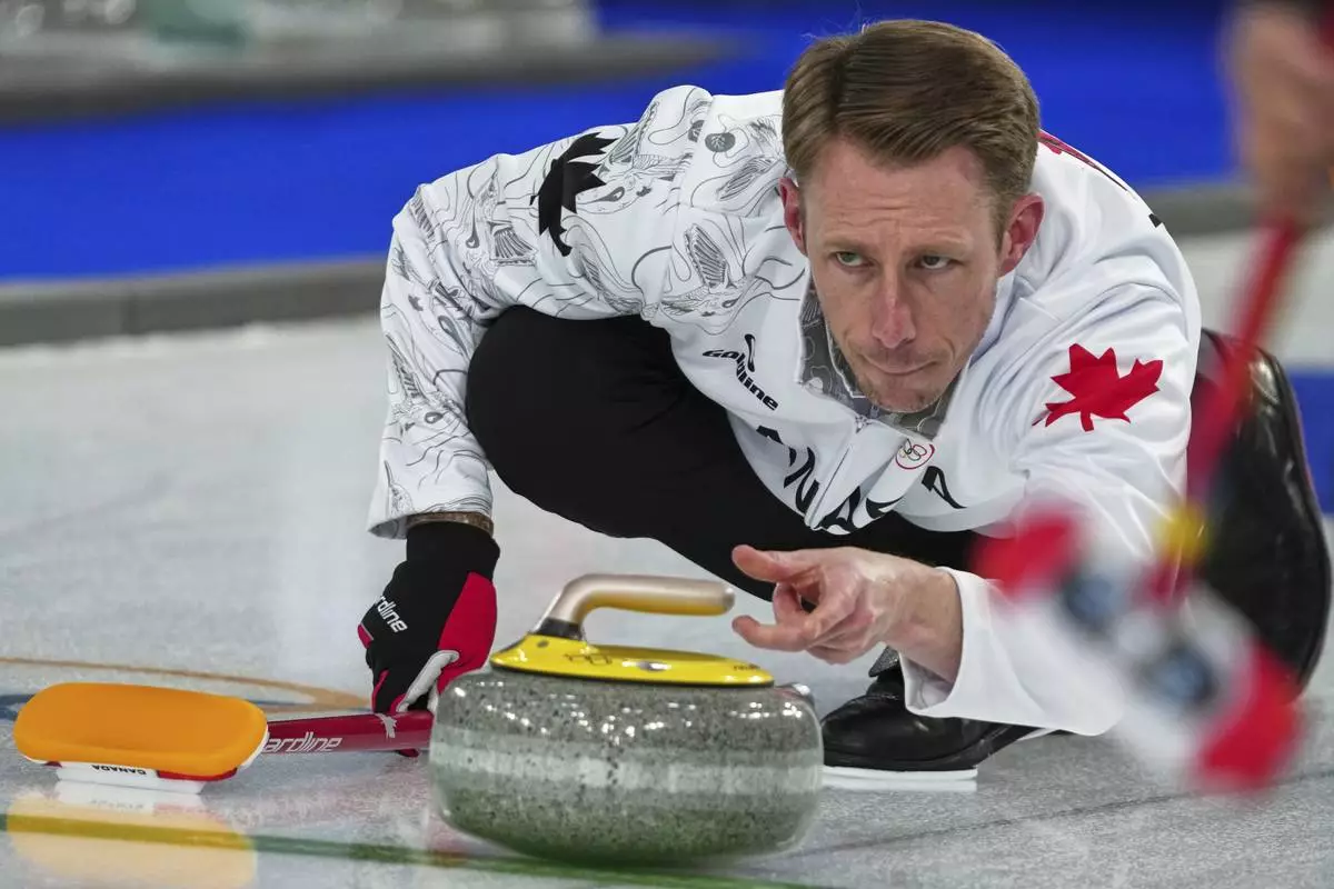 Canada's Marc Kennedy in action during the men's curling round robin session against China, at the 2026 Winter Olympics, in Cortina d'Ampezzo, Italy, Sunday, Feb. 15, 2026. (AP Photo/Misper Apawu)